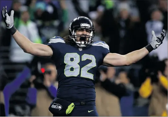  ??  ?? Canadian Luke Willson of the Seahawks celebrates his 25-yard touchdown reception against the Panthers.