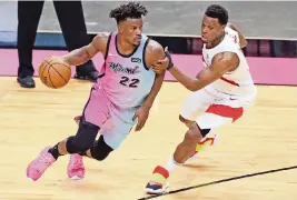  ?? AL DIAZ adiaz@miamiheral­d.com ?? Heat forward Jimmy Butler is close with Toronto Raptors guard Kyle Lowry, but it’s doubtful their friendship would influence Lowry to take less money to sign with Miami.