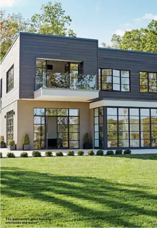  ??  ?? The bedroom’s glass balcony overlooks the water