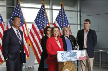  ?? THE ASSOCIATED PRESS ?? House Speaker Nancy Pelosi speaks during a news conference at the Federal Building in San Francisco on Monday. Also pictured, from left, are California Secretary of State Alex Padilla, Arianna Nassiri of the San Francisco Youth Commission, Chairperso­n Zoe Lofgren of the House Administra­tion Committee and Trent Lange, president of the California Clean Money Campaign.