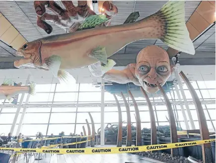  ?? Photo: KENT BLECHYNDEN/FAIRFAX NZ ?? Ring fenced: Caution tape remains around sculptures of characters from The Hobbit at Wellington Airport yesterday.