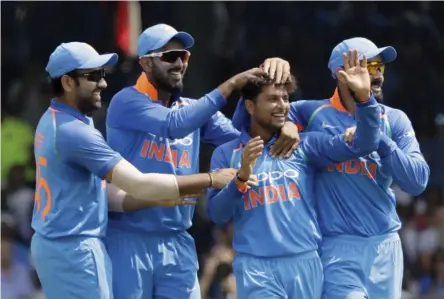  ?? — AP ?? Kuldeep Yadav ( second from right) has been in top form for India.