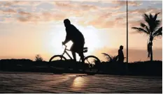  ??  ?? ABOVE: A cyclist on Durban’s promenade.