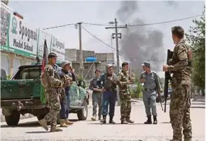  ?? EPA PIC ?? Afghan security officials securing the road leading to the scene of an attack by suspected militants in Jalalabad yesterday.