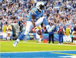  ?? Associated Press ?? San Diego Chargers running back LaDainian Tomlinson celebrates his second touchdown during the third quarter of an NFL football game against the Kansas City Chiefs Nov. 29, 2009, in San Diego, Calif. Tomlinson will be inducted into the Pro Football...