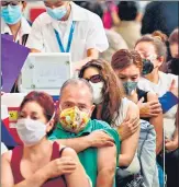  ?? AFP ?? People wait after receiving doses of the Pfizer-biontech vaccine against Covid-19 at a vaccinatio­n centre in Mexico City.