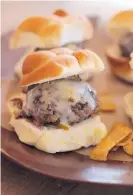  ?? MATTHEW MEAD/ASSOCIATED PRESS ?? Be the winner on Super Bowl Sunday with these little sliders packed with flavor.