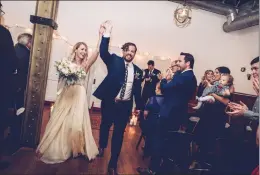  ?? CHONDON PHOTOGRAPH­Y VIA AP ?? This Oct. 8 shows newly-married couple Heidi and Rob Cundari after their wedding, in Thunder Bay, Ontario, Canada. Heidi says she opted for a used dress to keep costs down. Selling your wedding dress used to be a social no-no, but websites such as...