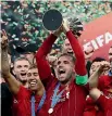  ??  ?? Liverpool captain Jordan Henderson holds aloft the trophy for the Club World Cup, but it’s the Premier League trophy that Liverpool fans everywhere are thirsting for.