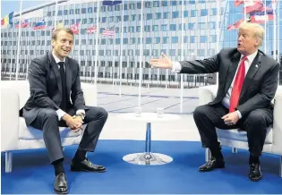  ?? PHOTO: REUTERS ?? Top level chat . . . French President Emmanuel Macron (left) and United States President Donald Trump speak to one another in a bilateral meeting on the sidelines of the Nato summit in Brussels yesterday.