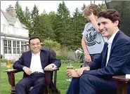  ?? ZHANG DUO / XINHUA ?? Xavier, the eldest son of Canadian Prime Minister Justin Trudeau, covers his face out of shyness after his trampoline landings were not quite steady.