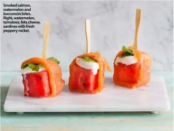  ??  ?? Smoked salmon, watermelon and bocconcini bites. Right, watermelon, tomatoes, feta cheese, sardines with fresh peppery rocket.