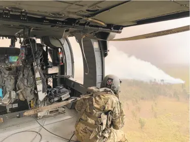  ?? U.S. Army 25th Combat Aviation Brigade ?? Members of the 25th Combat Aviation Brigade responding to a large brush fire on Hawaii’s Big Island.