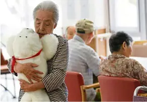  ??  ?? Paro, the furry baby seal robot is designed to help treat diseases like Alzheimer’s. — Reuters