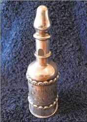  ?? COURTESY OF JANE ALEXIADIS ?? This may look like it would hold salt or pepper, but it’s actually a glove flask — an item considered crucial in the 19th century and into the early 20th century.