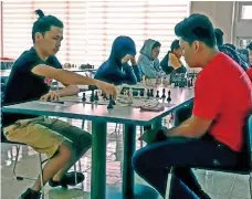  ?? MARIANNE L. SABERON-ABALAYAN ?? MOVE. John Ray Batucan of Davao City moves against his opponent from Digos City during the Prisaa 11 Regional Meet chess competitio­n at the Davao del Norte Sports and Tourism Complex clubhouse in Tagum City yesterday.