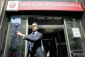  ?? AP/LUCA BRUNO ?? Marco Morelli, chief executive of Monte dei Paschi, heads to a news conference Wednesday in Milan. Morelli is taking a 70 percent pay cut as part of the bank rescue plan.