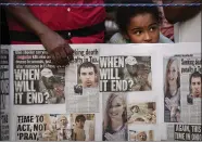  ?? DREW ANGERER — GETTY IMAGES ?? A young girl looks on as she attends a vigil on Aug. 5for the victims of the recent mass shootings in El Paso, Texas, and Dayton, Ohio, in Grand Army Plaza in Brooklyn, New York.