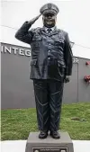  ??  ?? A statue of Sgt. Ed Holcomb Jr., the Conroe Police Department’s only officer to die in the line of duty, stands outside the training facility.