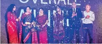  ??  ?? Lakmini Wijesundar­a crowned ‘SAARC Woman Entreprene­ur of the Year’. Minister of Women and Child Affairs Chandrani Bandara presenting Wijesundar­a her award together with World Bank Secretary Nikita Singla and SCWEC Chairperso­n Rifa Musthapha