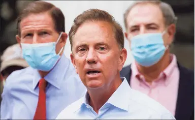  ?? John Minchillo / Associated Press ?? In this Aug. 7, photo, Gov. Ned Lamont addresses the media in Westport.