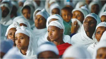  ?? (Tiksa Negeri/Reuters) ?? MEMBERS OF the Falash Mura community attend a prayer service at the HaTikvah Synagogue in Gondar, Ethiopia, in 2016.