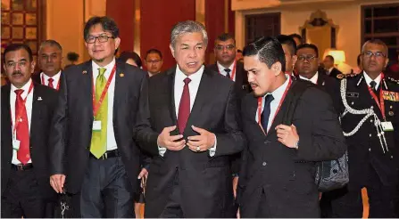  ??  ?? Appeal for help: Dr Ahmad Zahid (centre) at the 86th General Assembly of Interpol. With him are Datuk Zainuddin Yahya (second from left) and Inspector- General of Police Tan Sri Mohamad Fuzi Harun (background, right). — Bernama