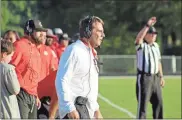  ??  ?? Head coach Doyle Kelley watches a defensive play from the sidelines during the first half of a scrimmage against Chattooga. The Bulldogs won 55-0.