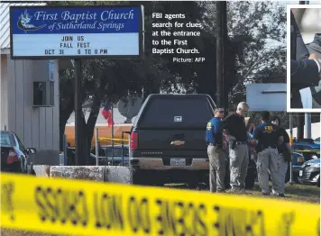  ?? Picture: AFP ?? FBI agents search for clues at the entrance to the First Baptist Church.