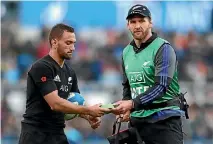  ??  ?? All Blacks captain Kieran Read, who was rested from the game in Rome, hands Aaron Cruden a kicking tee as he prepares to take a conversion against Italy.