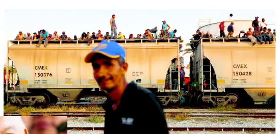  ?? AP ?? In this April 23, 2019 file photo, Central American migrants ride a freight train on their way to the US-Mexico border in Ixtepec, Oaxaca state, Mexico.