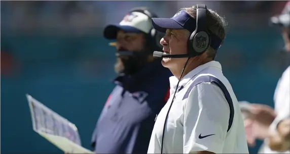  ?? LYNNE SLADKY — THE ASSOCIATED PRESS ?? Patriots head coach Bill Belichick, right, and Matt Patricia, senior football advisor, watch during the second half of a Sept. 11 game at the Miami Dolphins.