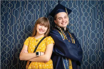  ?? PHOTOS BY WATCHARA PHOMICINDA — STAFF PHOTOGRAPH­ER ?? California Baptist University graduate Michael Friederang, 16, and sister Eliza, 13, who also attends the private Riverside university, pose after his Wednesday graduation.