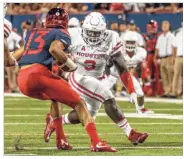  ?? University of Houston Athletics ?? Defensive lineman Reggie Chevis, right, has started both games for UH this season.