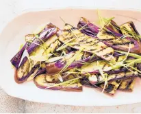  ??  ?? Thinly sliced like bulgogi, eggplants need only a brief flick of the fire to cook through and char at the edges.