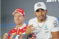  ?? Picture: AFP ?? REVVED UP: Mercedes' British driver Lewis Hamilton, right, and Ferrari's German driver Sebastian Vettel are set to do battle again