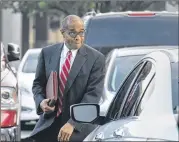  ?? HYOSUB SHIN / HSHIN@AJC.COM ?? Elvin “E.R.” Mitchell Jr. walks to federal court Oct. 10. He was sentenced to five years in jail for his role in a City Hall bribery scheme.