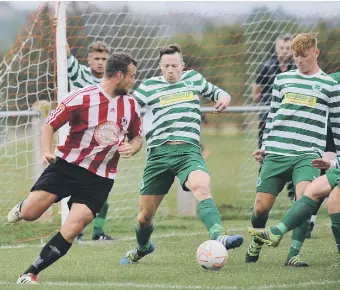  ??  ?? Action between Sunderland West End (red white) and Cleator Moor Celtic