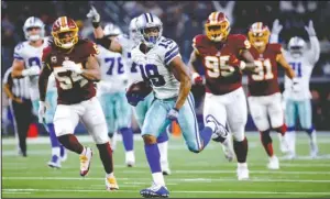  ?? The Associated Press ?? ALL COOPED UP: Dallas wide receiver Amari Cooper (19) runs in for a touchdown Thursday against Washington during the second half of the Cowboys 31-23 win over the Redskins on Thanksgivi­ng in Arlington, Texas.