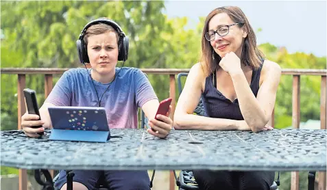  ??  ?? Lo-tech: Anna Maxted and her son Conrad, who is reluctantl­y embracing less screen time
