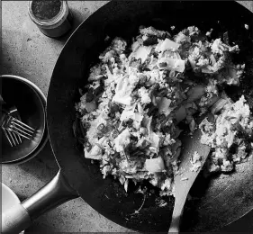  ?? DAVID MALOSH / THE NEW YORK TIMES ?? Bacon, egg and cheese fried rice. These foods are combined into a tasty mashup in Kay Chun’s recipe. Oher grains can be used in place of rice.