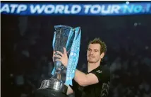  ?? REUTERS ?? Andy Murray with the spoils after beating Novak Djokovic in the final of the ATP World Tour Finals in London last month.