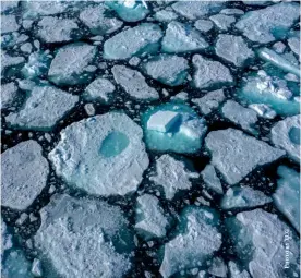  ?? ?? Above: A resident looks at the fully exposed pier of Jialing River Bridge in Chongqing, while standing on the dried-up bed of the river, August 21, 2022
Below: The arctic sea ice pack near the Svalbard Islands in Norway, July 17, 2022. Satellite data show that around 1.5 million square kilometers of sea ice in the Arctic regions has melted since 1970