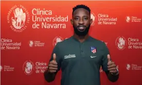  ??  ?? Moussa Dembélé poses for a picture after completing his Atlético Madrid medical. Photograph: Atletico Madrid/EPA
