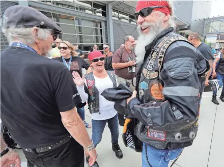  ?? RICK WOOD / MILWAUKEE JOURNAL SENTINEL ?? "It was a wonderful trip. You gotta keep that throttle twisted to get over here,” said Curtis May (right) of Beaumont, Texas, on Tuesday at the Harley-Davidson Museum. May was greeting Willie G. Davidson after riding from Texas to San Diego and then Milwaukee for the Harley-Davidson 115th anniversar­y celebratio­n.