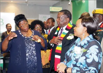  ?? — (Picture by John Manzongo) ?? President Mnangagwa, First Lady Auxilia Mnangagwa and Women and Youth Affairs Minister Sithembiso Nyoni listen to Women’s Microfinan­ce Bank chief executive officer Mrs Mandas Marikanda at the bank’s official opening ceremony in Harare yesterday.