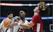  ?? (NWA Democrat-Gazette/Charlie Kaijo) ?? Arkansas freshman guard Anthony Black (right) is fouled by Auburn’s Zep Jasper during Thursday night’s game. Black finished with 19 points, 6 rebounds and 6 assists.