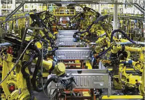  ??  ?? Robot dominates: Ford F150 trucks go through robots on the assembly line at the Ford Dearborn Truck Plant in Dearborn, Michigan. Robots are also entering areas such as logistics warehousin­g, chemicals and plastics factories and F&amp;B industries. — AFP