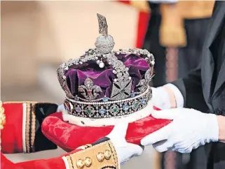  ?? ?? Out of touch The Queen’s crown, thought to be worth billions of pounds, was paraded in as part of the opening of Parliament last week, amidst a cost of living crisis and rise in poverty