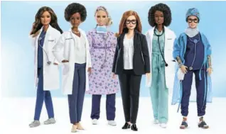  ?? PICTURE: © MATTEL ?? Barbie dolls made in the likeness of Sarah Gilbert (middle in suit), the Oxford University professor who co-designed the Oxford/AstraZenec­a vaccine, and a lineup of other women in the health-care sector honoured by toymaker Mattel.